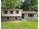 Charming home featuring a unique exterior with shutters and well-maintained lawn at 8432 Magnolia Dr, Jonesboro, GA 30238