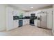 Modern kitchen with new appliances, white cabinets, and a stylish backsplash at 8432 Magnolia Dr, Jonesboro, GA 30238