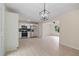 Open concept kitchen features stainless steel appliances and modern lighting fixtures at 8432 Magnolia Dr, Jonesboro, GA 30238