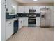 Bright kitchen features stainless steel appliances, modern cabinetry, and sleek countertops at 8432 Magnolia Dr, Jonesboro, GA 30238