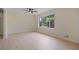 Bright living room featuring new flooring, and a large window offering natural light at 8432 Magnolia Dr, Jonesboro, GA 30238