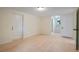 Spacious living room with hardwood floors and a bright, airy feel with staircase in view at 8432 Magnolia Dr, Jonesboro, GA 30238