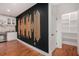 Modern bar area with white cabinets, wine fridge, wood floors, and walk-in pantry at 1721 S Gordon Sw St, Atlanta, GA 30310
