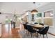 Dining area view showcasing access to the modern kitchen, hardwood floors, and bright natural light at 1721 S Gordon Sw St, Atlanta, GA 30310