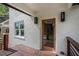 Front entrance featuring a wooden door, decorative lighting, and a modern porch design at 1721 S Gordon Sw St, Atlanta, GA 30310