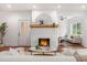 Cozy living room featuring a fireplace, hardwood floors, and ample natural light at 1721 S Gordon Sw St, Atlanta, GA 30310