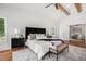Bright and stylish main bedroom showcasing wooden beams, neutral tones, and modern decor at 1721 S Gordon Sw St, Atlanta, GA 30310