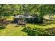 Aerial view of a spacious backyard with a deck and garden boxes at 3770 Ponderosa Ln, Powder Springs, GA 30127