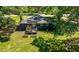 Aerial view of a spacious backyard with a deck and garden boxes at 3770 Ponderosa Ln, Powder Springs, GA 30127