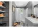 Cozy bathroom featuring a tub/shower combo and built-in shelves for storage at 3770 Ponderosa Ln, Powder Springs, GA 30127