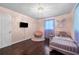 Charming bedroom with hardwood floors, natural light and cozy decor at 3770 Ponderosa Ln, Powder Springs, GA 30127
