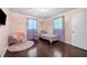 Bright bedroom with hardwood floors, natural light and cozy decor at 3770 Ponderosa Ln, Powder Springs, GA 30127