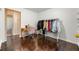 Walk-in closet with hardwood floors, built-in shelving, and a clothing rack at 3770 Ponderosa Ln, Powder Springs, GA 30127