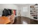 Spacious closet with hardwood floors, shelving, and a clothing rack at 3770 Ponderosa Ln, Powder Springs, GA 30127