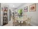 Bright dining area with access to the kitchen and a sliding glass door to the backyard at 3770 Ponderosa Ln, Powder Springs, GA 30127
