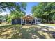 Charming home featuring a covered porch and well-maintained lawn at 3770 Ponderosa Ln, Powder Springs, GA 30127