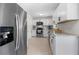 Spacious kitchen with stainless steel appliances, granite countertops, and ample cabinet space at 3770 Ponderosa Ln, Powder Springs, GA 30127