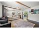 Bright living room with hardwood floors, exposed beams, and neutral décor at 3770 Ponderosa Ln, Powder Springs, GA 30127