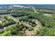 An aerial view features tree-lined streets and homes in a well-developed suburban area at 4303 Anderson Ridge Dr, Austell, GA 30106
