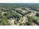 Extensive aerial view of homes nestled in a lush, green, wooded suburban landscape at 4303 Anderson Ridge Dr, Austell, GA 30106