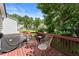 A cozy outdoor seating area on the back deck, perfect for enjoying the green surroundings at 4303 Anderson Ridge Dr, Austell, GA 30106