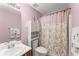 Charming bathroom with decorative shower curtain, ample storage, and soft lighting at 4303 Anderson Ridge Dr, Austell, GA 30106
