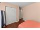 Simple bedroom design with hardwood floors and light peach colored walls creates a comfortable living space at 4303 Anderson Ridge Dr, Austell, GA 30106