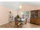 Dining room featuring a modern chandelier, hardwood floors, large window, and stylish furnishings at 4303 Anderson Ridge Dr, Austell, GA 30106