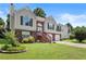 Charming two-story home with a well-manicured lawn and a two-car garage at 4303 Anderson Ridge Dr, Austell, GA 30106
