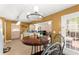 Cozy eat-in kitchen with wooden table and chairs offers views into other areas of the house at 4303 Anderson Ridge Dr, Austell, GA 30106