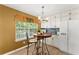 Eat-in kitchen features white cabinets, stainless steel appliances, and a window offering a backyard view at 4303 Anderson Ridge Dr, Austell, GA 30106