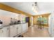 Bright kitchen with white cabinets, granite countertops, and stainless steel appliances offers a charming breakfast nook at 4303 Anderson Ridge Dr, Austell, GA 30106