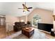 Bright living room boasting a vaulted ceiling, large windows, plush seating, and hardwood floors at 4303 Anderson Ridge Dr, Austell, GA 30106