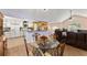 Open-concept living and dining area with hardwood floors, seamlessly connecting the spaces for easy living at 4303 Anderson Ridge Dr, Austell, GA 30106