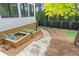 Landscaped backyard featuring raised garden beds and a charming stone pathway at 4495 Westgate Dr, Cumming, GA 30040