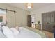 Comfortable bedroom with a barn door, double closets, and stylish decor at 4495 Westgate Dr, Cumming, GA 30040