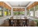 Sun-drenched breakfast nook with bench seating and windows overlooking a private backyard at 4495 Westgate Dr, Cumming, GA 30040