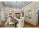 Dining room with a large table, neutral-toned walls, and hardwood flooring at 4495 Westgate Dr, Cumming, GA 30040