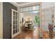 View of the dining room with hardwood floors, an elegant chandelier, and neutral paint at 4495 Westgate Dr, Cumming, GA 30040