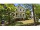 Beautiful two-story house with a classic porch and lush front yard landscaping at 4495 Westgate Dr, Cumming, GA 30040