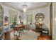 Stylish home office featuring hardwood floors, natural light, and a decorative chandelier at 4495 Westgate Dr, Cumming, GA 30040