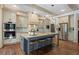 Stylish kitchen boasting a large island with seating, stainless steel appliances, and elegant design at 4495 Westgate Dr, Cumming, GA 30040