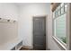 Practical mudroom area with a bench, storage, and natural light at 4495 Westgate Dr, Cumming, GA 30040