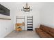 Charming pool house interior with a desk, shelving, and seating area for a cozy retreat by the pool at 4495 Westgate Dr, Cumming, GA 30040