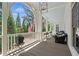 Spacious porch featuring comfortable seating and a view of the well maintained lawn at 4495 Westgate Dr, Cumming, GA 30040