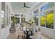 Bright sunroom with many windows and hanging swing at 4495 Westgate Dr, Cumming, GA 30040