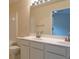 Bright bathroom featuring a double sink vanity, large mirror, and bathtub-shower combo at 5587 Trace Views Dr, Norcross, GA 30071