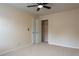 Bedroom features neutral walls, carpet floors, and ceiling fan at 5587 Trace Views Dr, Norcross, GA 30071
