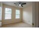 Bedroom featuring neutral colors, natural light and ceiling fan at 5587 Trace Views Dr, Norcross, GA 30071