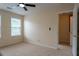 Spacious bedroom with carpet, natural light and entry to bathroom at 5587 Trace Views Dr, Norcross, GA 30071